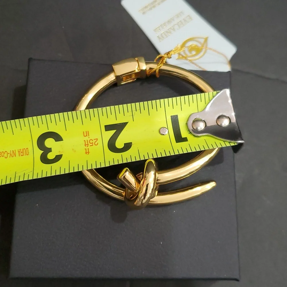 Eye Candy gold tone knot and point open‎ cuff hinged bracelet bangle brand new